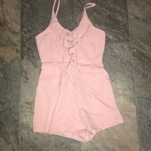 light pink tie up romper with pockets